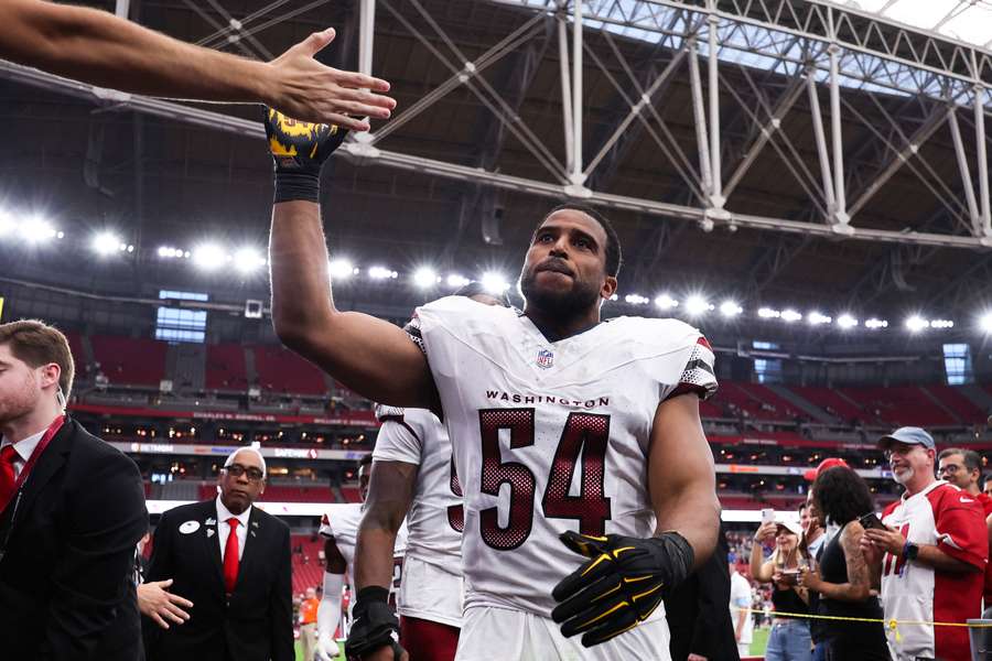 Bobby Wagner high-fiving Commanders fans after a game against the Arizona Cardinals (2024)