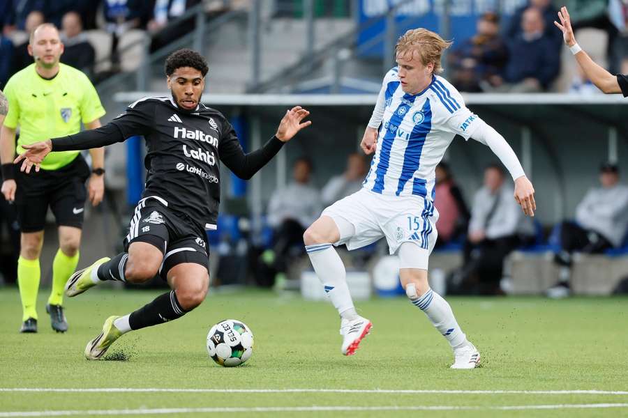 Yohan Cassubie of Lahti and Jere Kallinen of HJK fight for possession