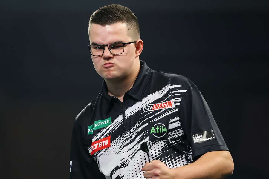 Gian van Veen celebrates during his opening PDC World Darts Championship match against Cristo Reyes Gian van Veen celebrates during his opening PDC World Darts Championship match against Cristo Reyes