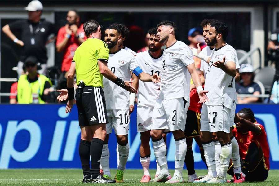 Egypt's players remonstrate with the referee during the draw with Belgium Egypt's players remonstrate with the referee during the draw with Belgium