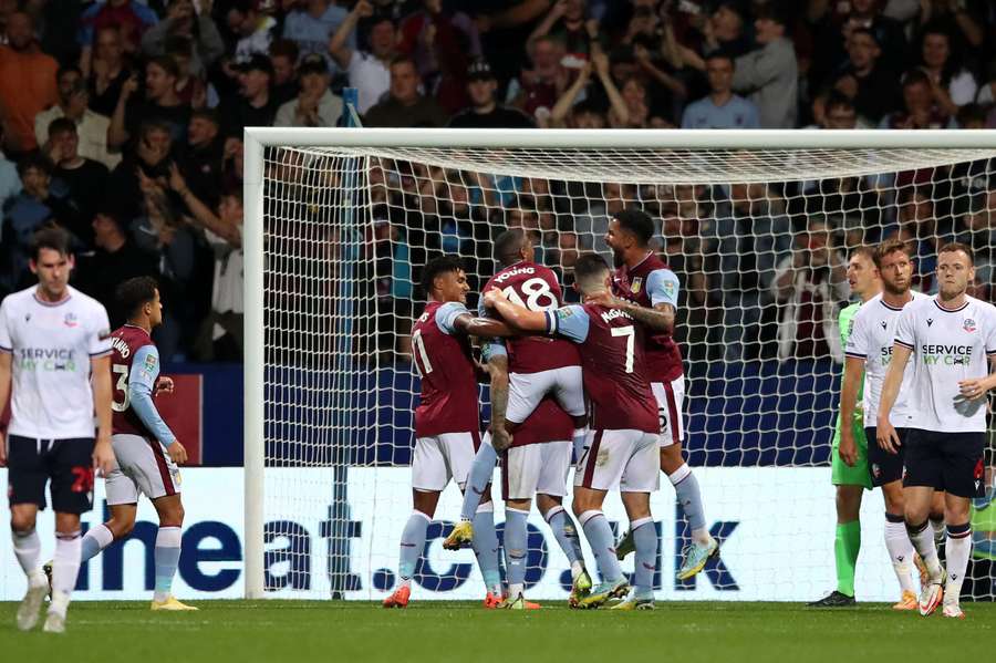 Aston Villa celebrate their second against Bolton in front of their travelling fans