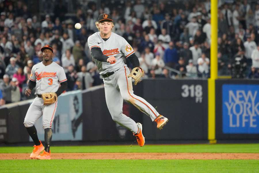 Baltimore Orioles' Gunnar Henderson throws out New York Yankees' Harrison Bader during the tenth inning at Yankee Stadium