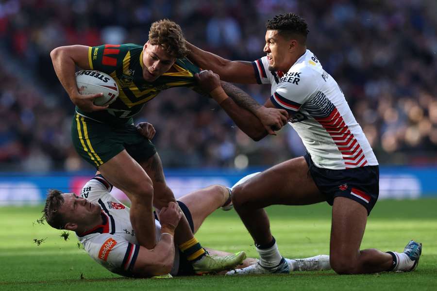 Reece Walsh, the Player of the Match in Game 1, is held up by Kai Pearce-Paul at Wembley Stadium. Reece Walsh, the Player of the Match in Game 1, is held up by Kai Pearce-Paul at Wembley Stadium.