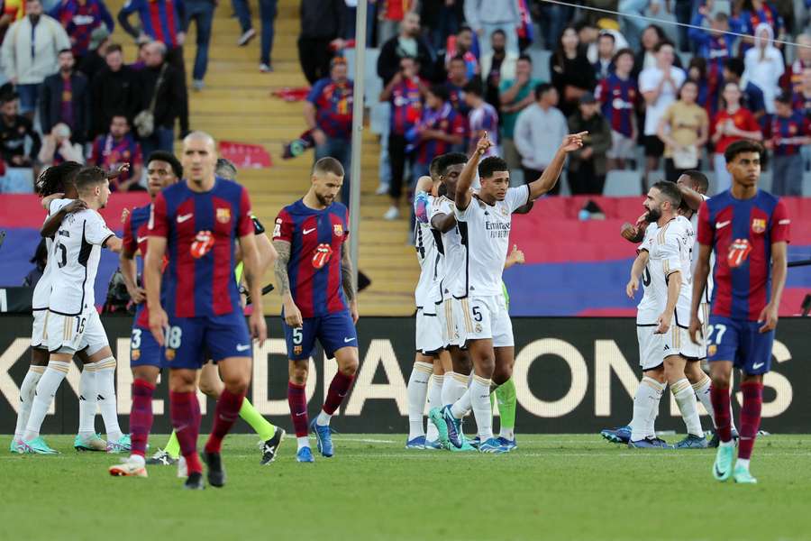 Real Madrid players celebrate their win at the end of the Spanish league football match between FC Barcelona and Real Madrid CF