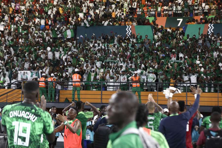 Nigeria supporters celebrate after beating Angola at AFCON 2024