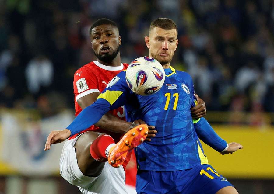 Austria's Kevin Danso (L) vies with Bosnia and Herzegovina's Edin Dzeko Austria's Kevin Danso (L) vies with Bosnia and Herzegovina's Edin Dzeko