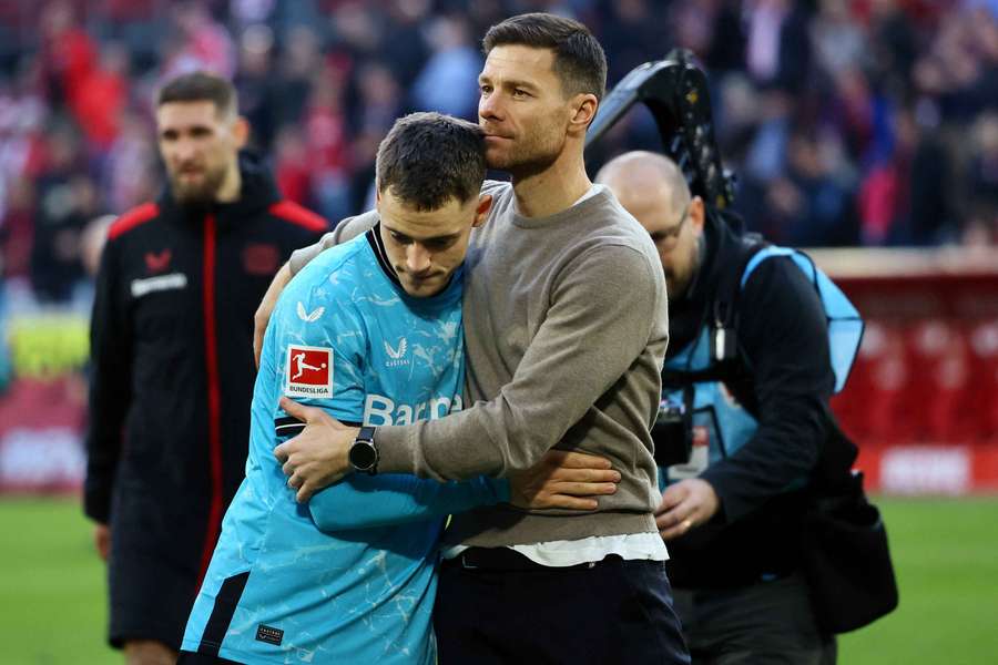 Bayer Leverkusen coach Xabi Alonso and Florian Wirtz celebrate after the match