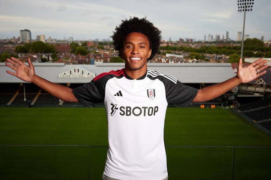 Willian poses for a photo at Craven Cottage