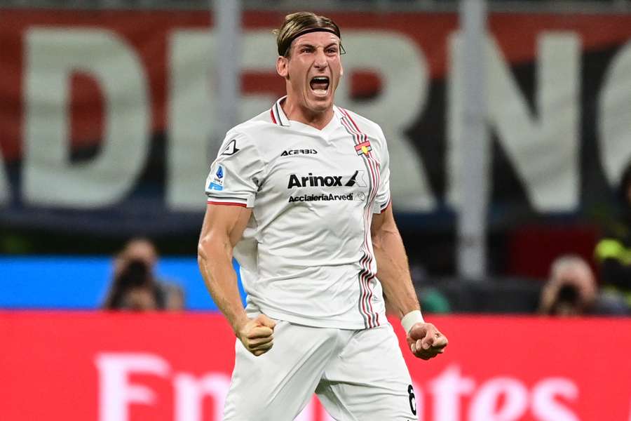 Cremonese's Italian defender Federico Baschirotto celebrates scoring against Milan