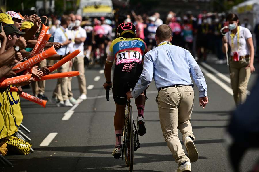 EF Education - Easypost's Richard Carapaz is assisted after crossing the finish line having suffered a crash earlier in the stage