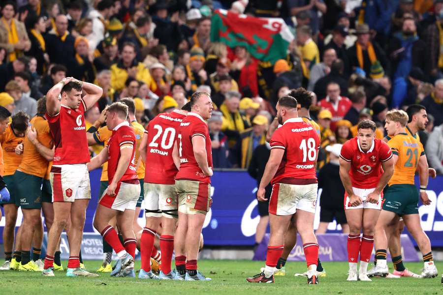 Despondent Wales' players react after their defeat to Australia in Sydney