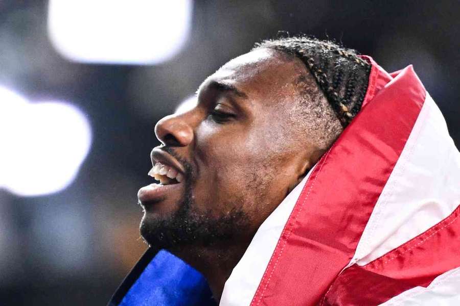 Noah Lyles celebrates after winning the men's 200m final