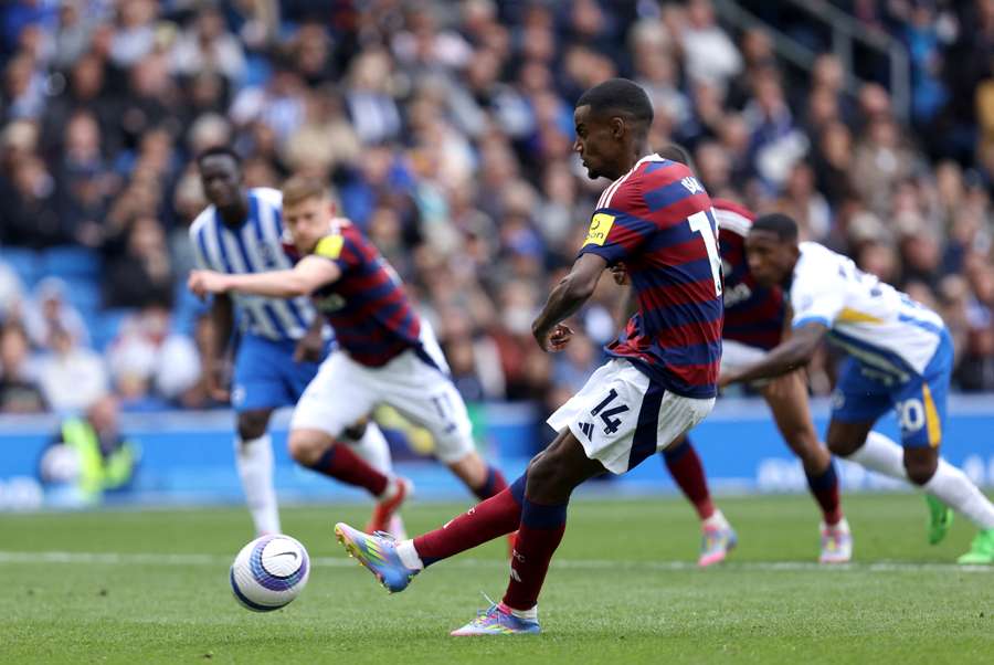 Newcastle's Alexander Isak scores his team's first goal from the penalty spot