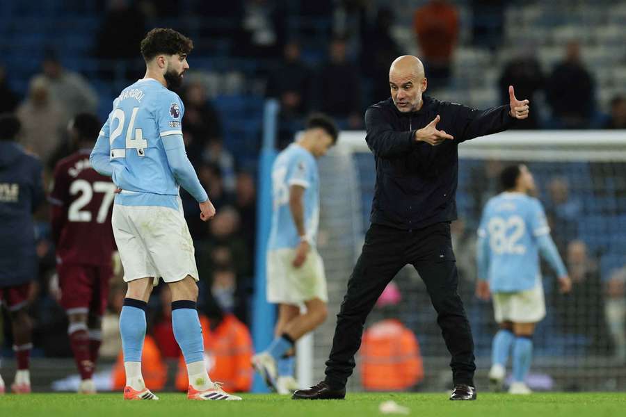 Pep Guardiola speaks to Jozko Gvardiol after Manchester City's win over West Ham