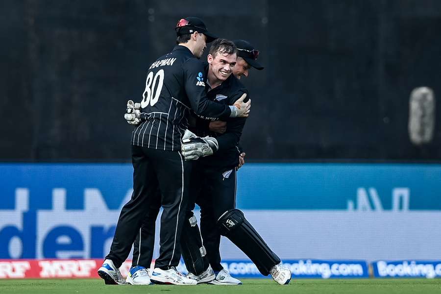 Latham celebrates with New Zealand teammates