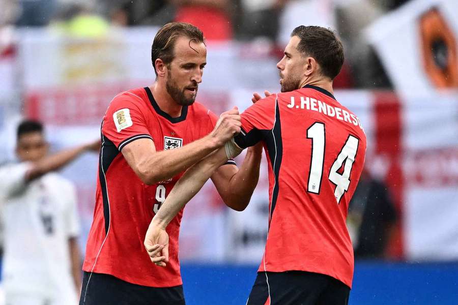 Harry Kane gives the captains armband to Jordan Henderson after being substituted against Panama