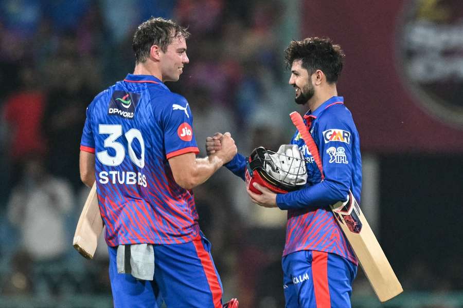 Tristan Stubbs and teammate Sameer Rizvi celebrate their team's win