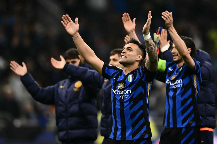 Inter Milan celebrating with their fans after defeating Bayern Munich over two legs in the UEFA Champions League.