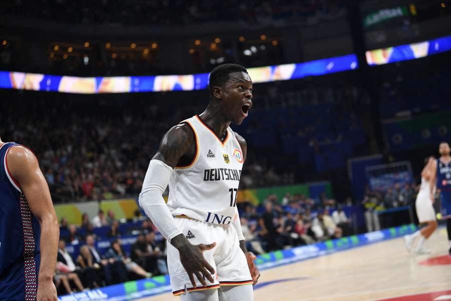 Germany's Dennis Schroder reacts after dunking the ball against Serbia
