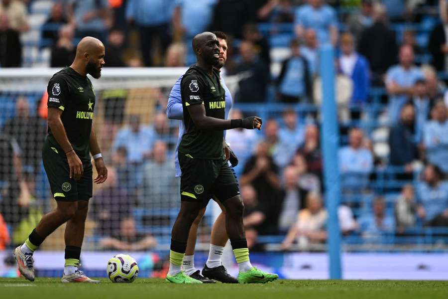 Wissa hobbles off against Man City