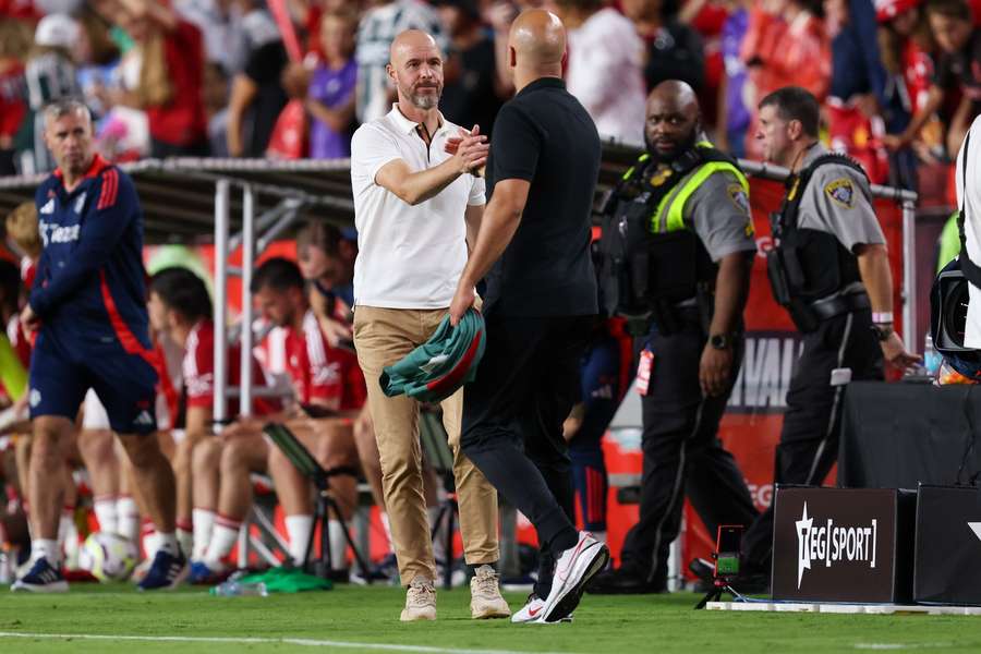 Liverpool head coach Arne Slot and Manchester United manager Erik Ten Hag shake hands