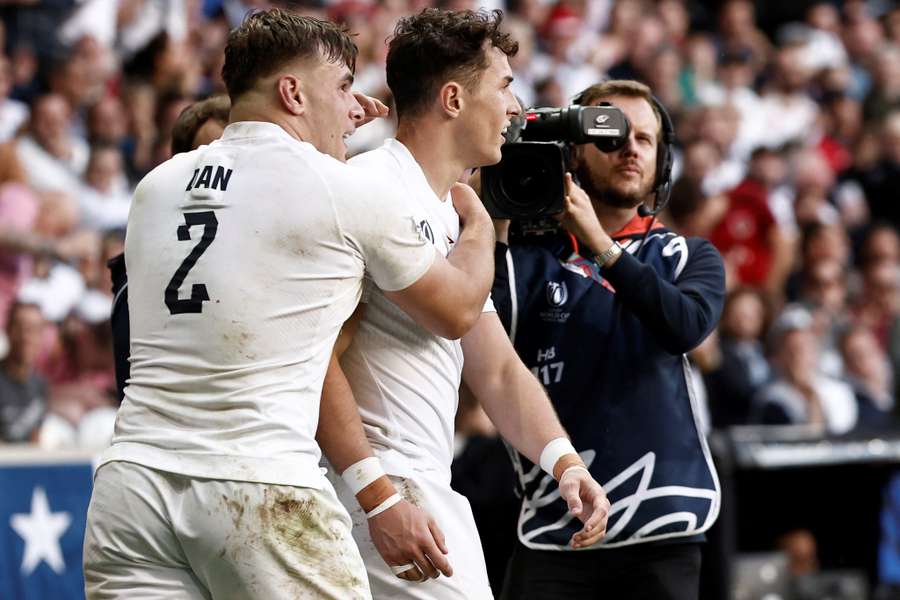 England wing Henry Arundell (R) celebrates with hooker Theo Dan after scoring a try