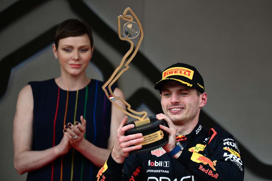 Red Bull Racing driver Max Verstappen poses with his trophy on the podium