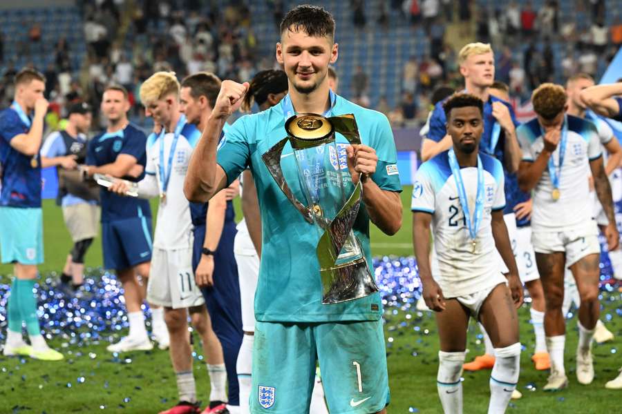 England's players celebrate with the trophy