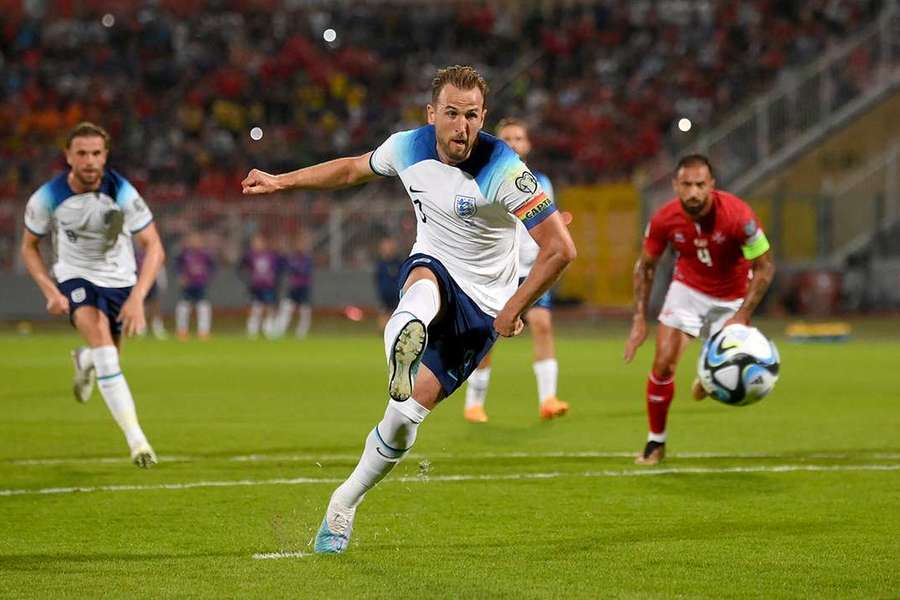 England striker Harry Kane shoots and scores