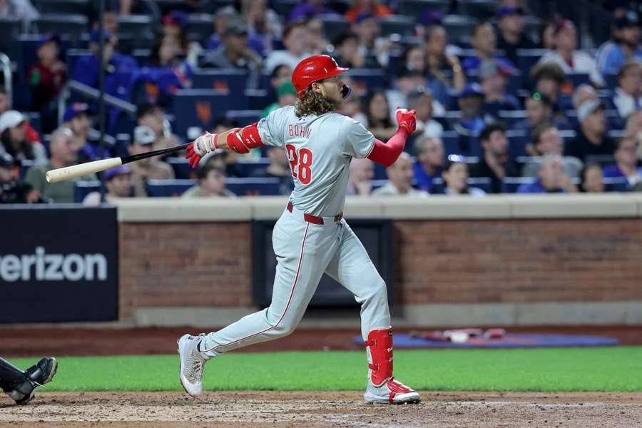 Bohm follows through on a three-run home run against the Mets