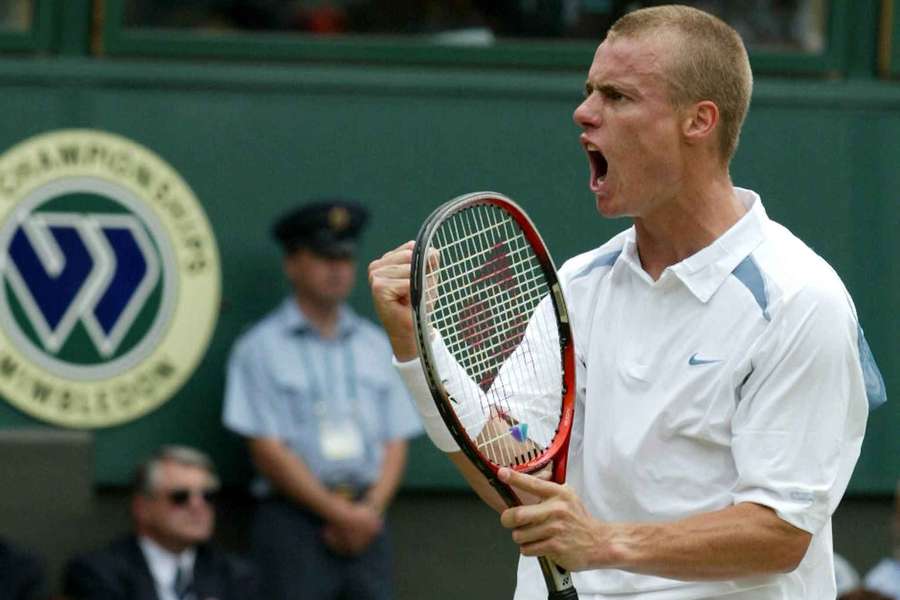 Lleyton Hewitt gestures in celebration during the 2002 Wimbledon Championships. Lleyton Hewitt gestures in celebration during the 2002 Wimbledon Championships.