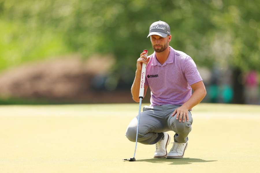 Wyndham Clark of the United States lines up a putt