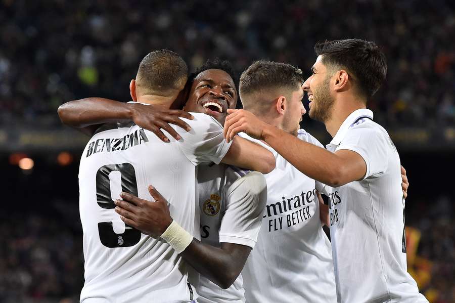 Real Madrid celebrate after Karim Benzema scored their fourth goal