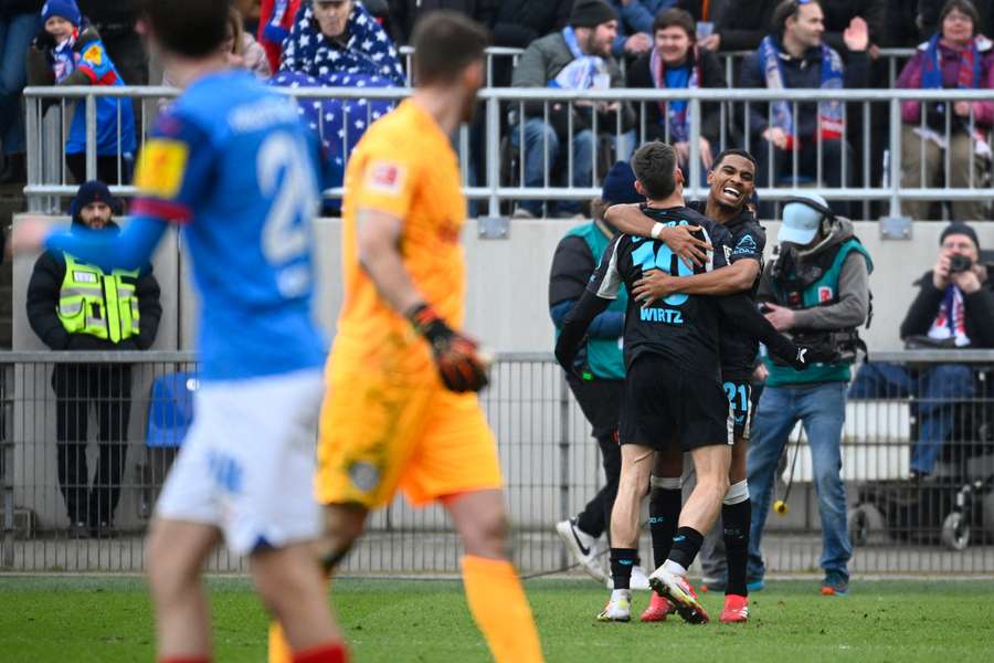 Adli (right) celebrates his goal