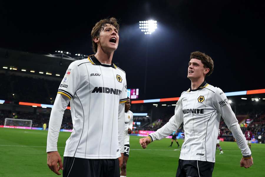 Fer Lopez celebrates scoring Wolves' first goal with teammate Sean Neave