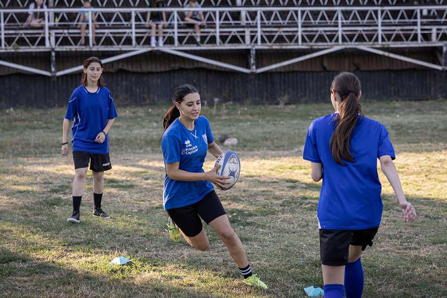 Cristina Stan (C), 16 and team colleagues play during the training session on the student's sports complex "Tei" rugby field