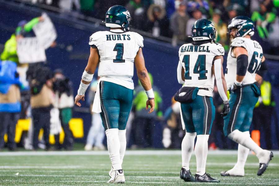 Philadelphia Eagles quarterback Jalen Hurts walks to sideline after throwing an interception against the Seattle Seahawks during the fourth quarter