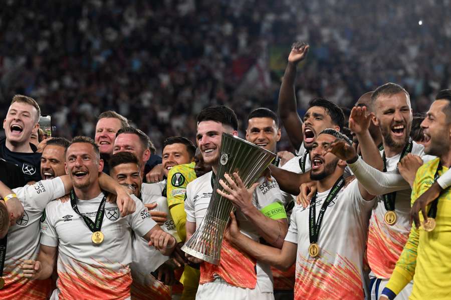 West Ham players including English midfielder Declan Rice (C) celebrate with the trophy after winning the UEFA Europa Conference League final