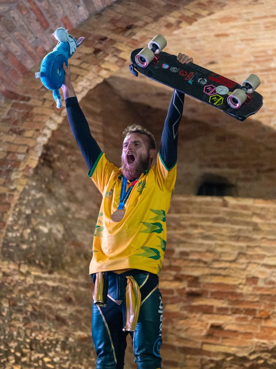 Harry Clarke celebrates winning the men's downhill at the 2024 World Skate Games in Tortoreto, Italy