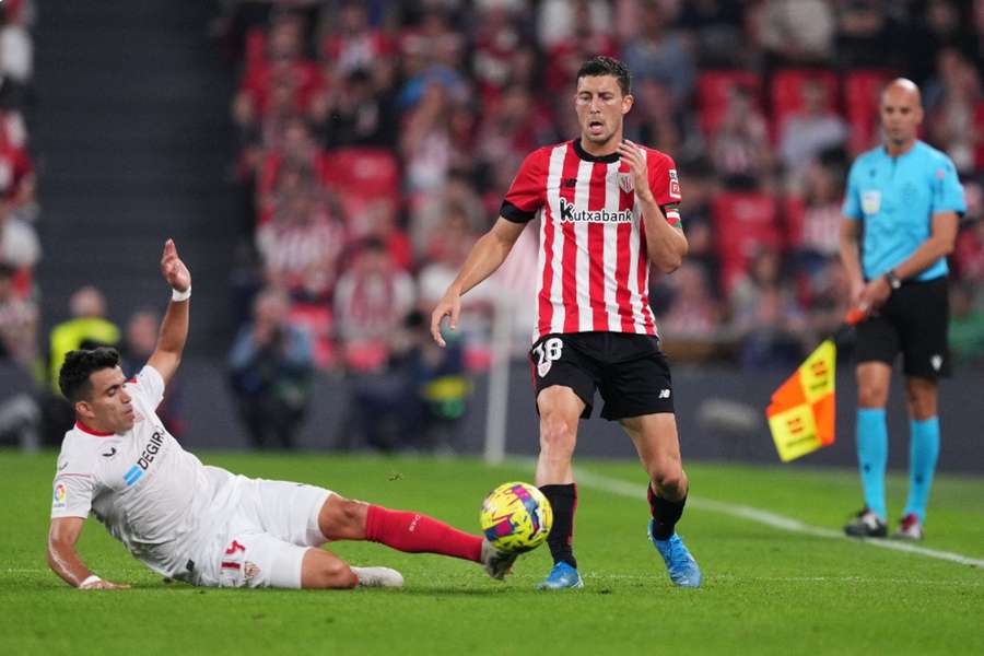 Marcos Acuna tackles Athletic Bilbao's Dani Garcia