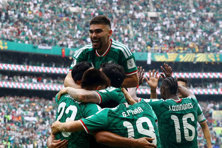 Mexico's Raul Jimenez celebrates scoring their second goal with teammates