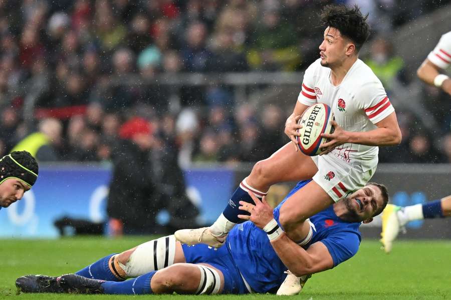 Willemse tackles England fly-half Marcus Smith (pictured with the ball)