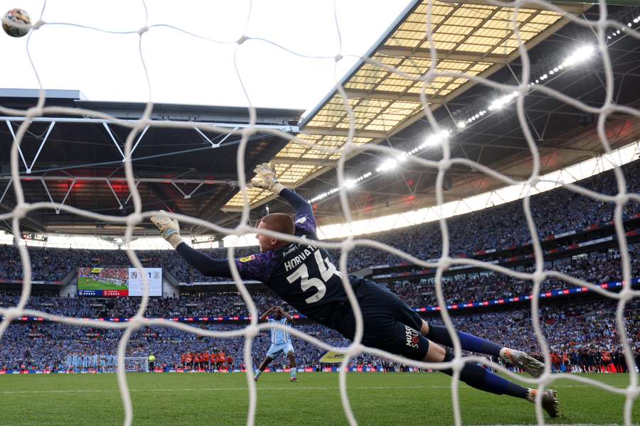 Coventry City's Fankaty Dabo (C) reacts as his penalty misses the target to gift Luton the victory in the English Championship play-off final