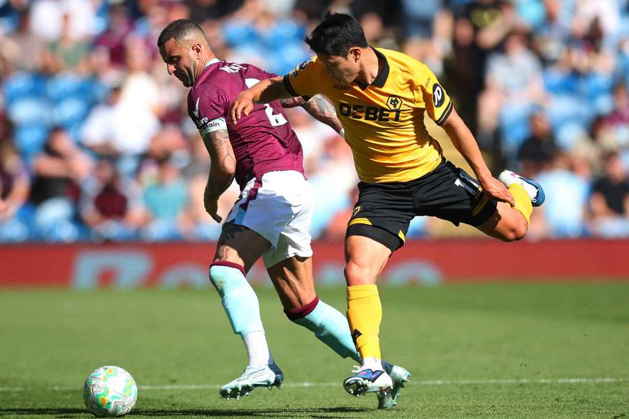 Wolverhampton Wanderers' Hwang Hee-Chan in action with Burnley's Kyle Walker