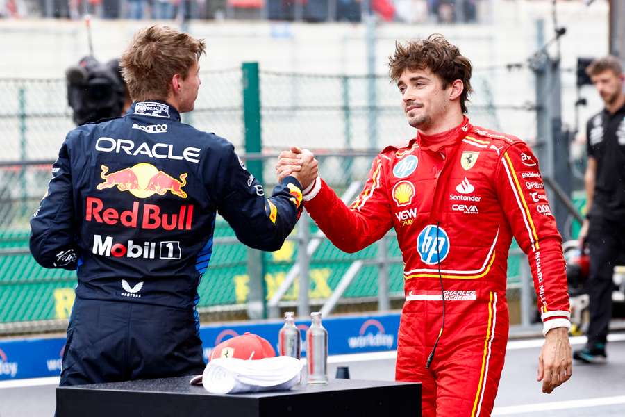 Red Bull Racing's Dutch driver Max Verstappen (L) shakes hands with Ferrari's Monegasque driver Charles Leclerc 