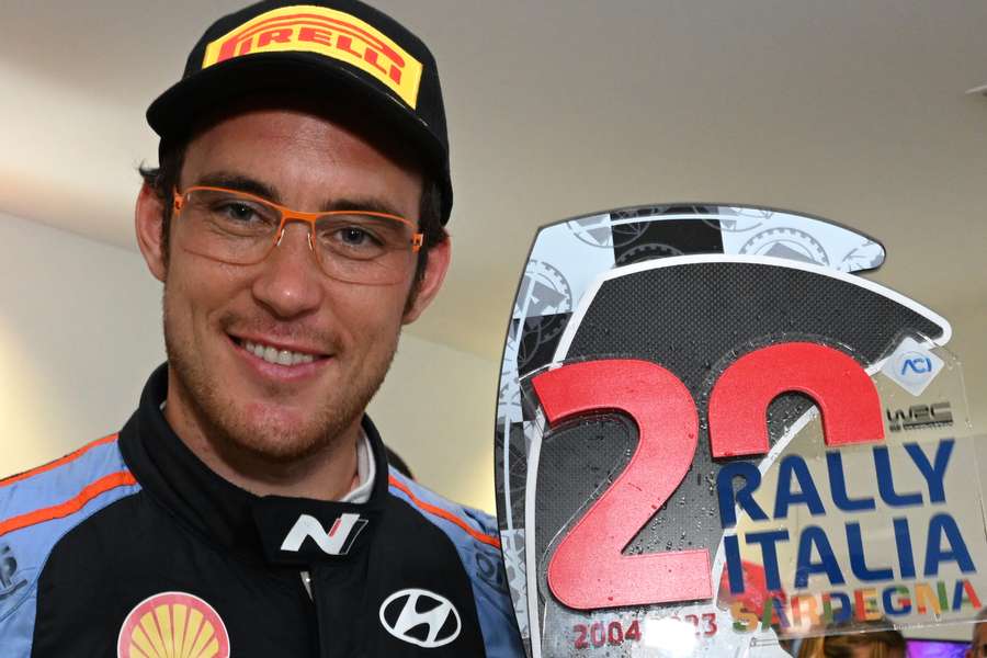 Belgian rally driver Thierry Neuville poses with his trophy after winning