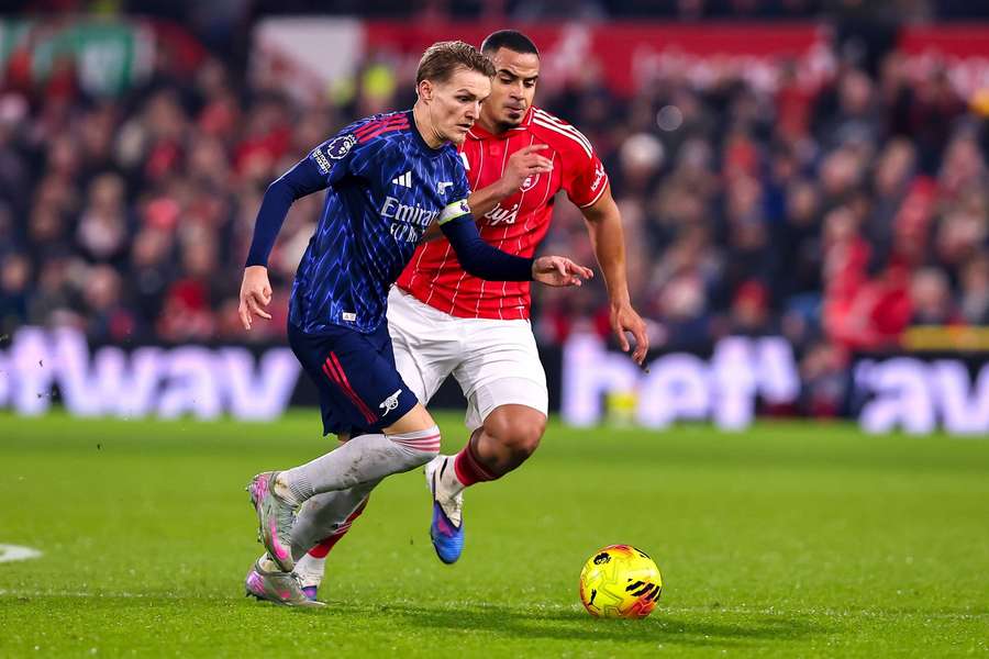 Arsenal's Martin Odegaard is put under pressure by Nottingham Forest's Murillo
