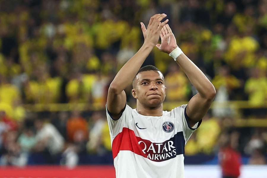 Mbappe applauds the PSG fans after the first leg in Dortmund