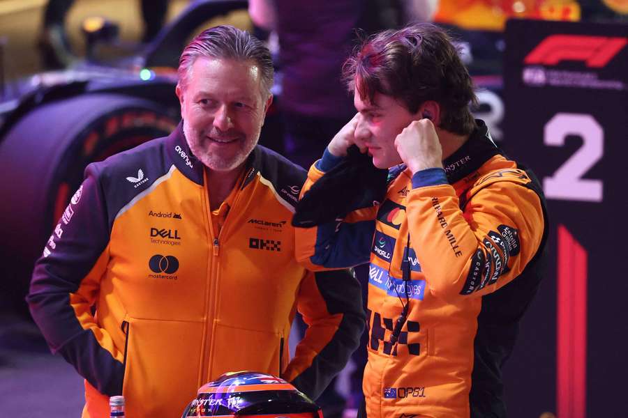 Oscar Piastri (right) celebrates with McLaren chief executive Zak Brown