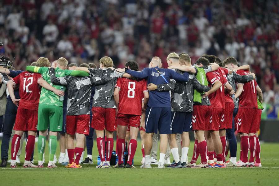 Denmark players on a huddle after the match vs Serbia